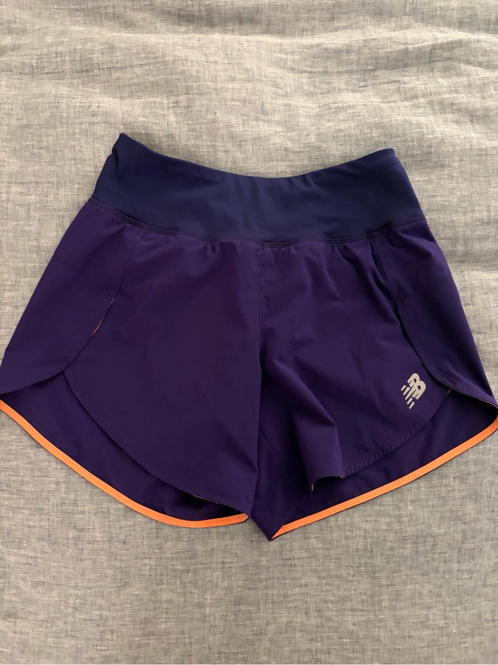 New Balance Women's Deep Purple Running Shorts with Orange Edge
